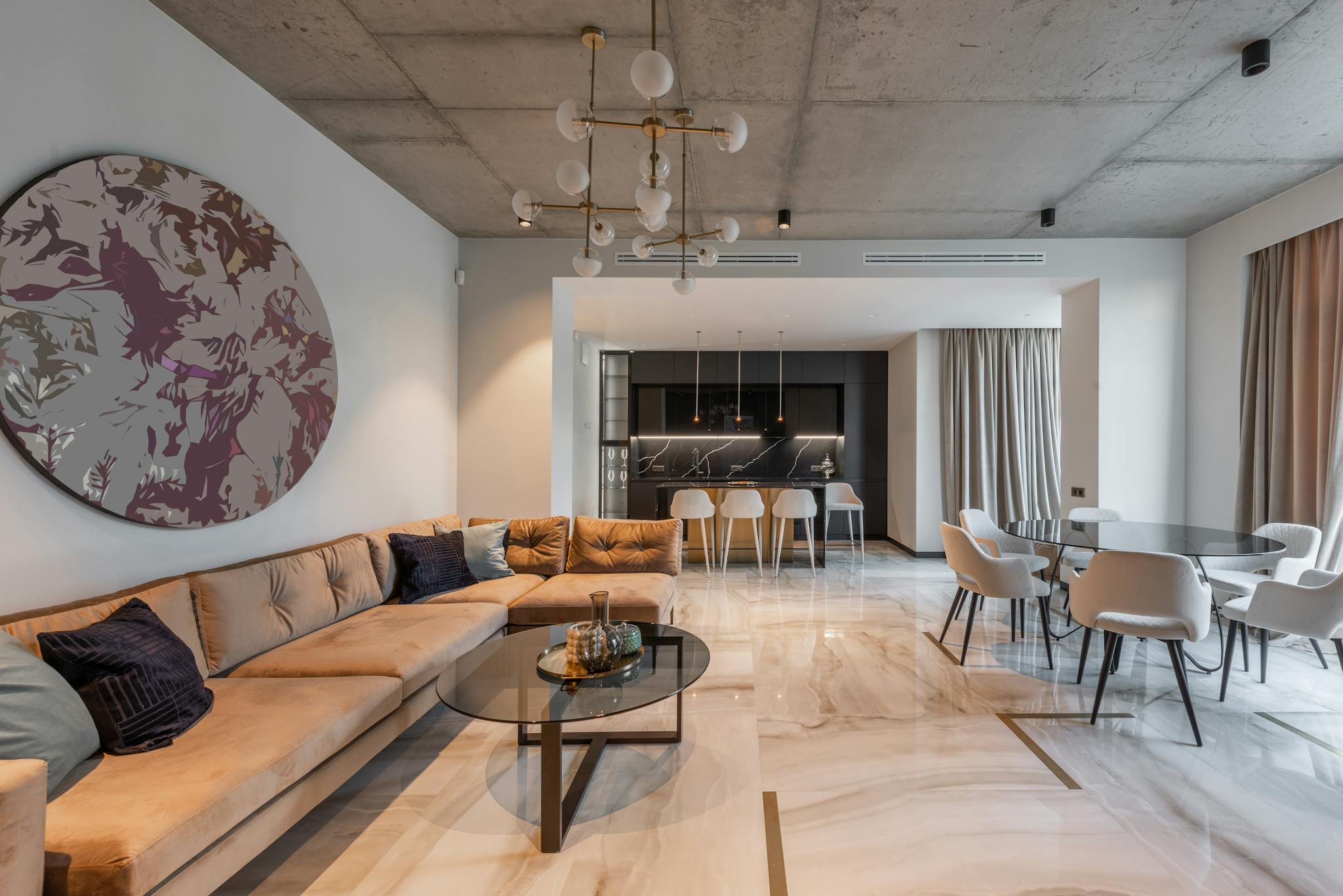 Spacious modern living room with elegant furniture and stylish decor, showcasing a contemporary lifestyle.